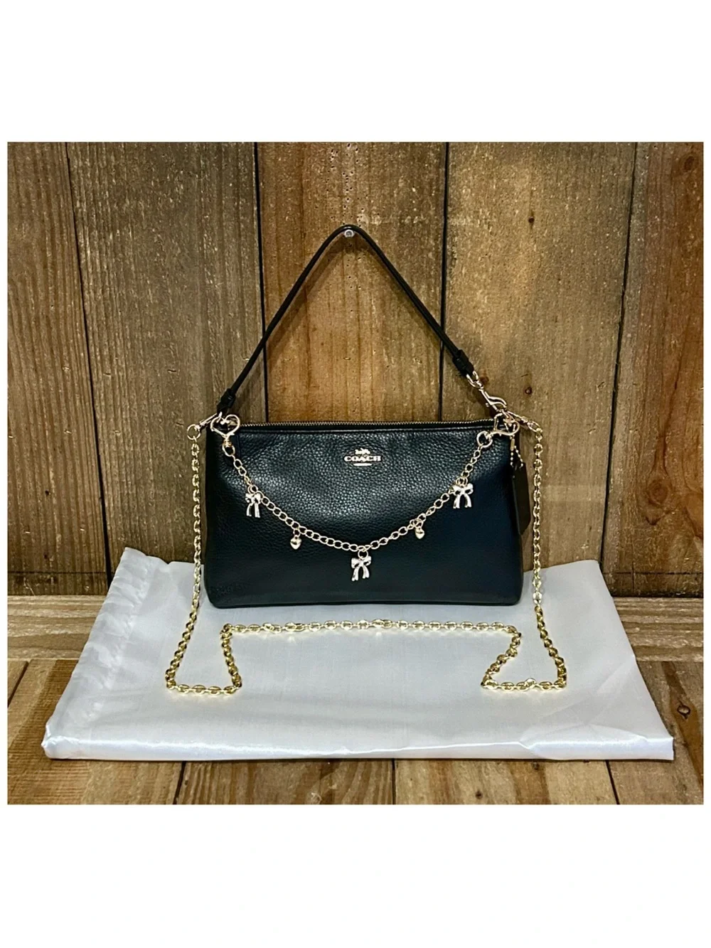 Coach. 4 Piece: Large Wristlet 25 with Free Eyeglasses, Bow Charm & Chain Strap. - Picture 9 of 16
